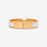 HERMÈS HERMES CLIC H GULD/HVID